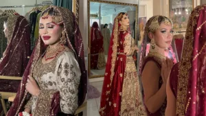 Bride in a perfect bridal fit looking at herself in the mirror