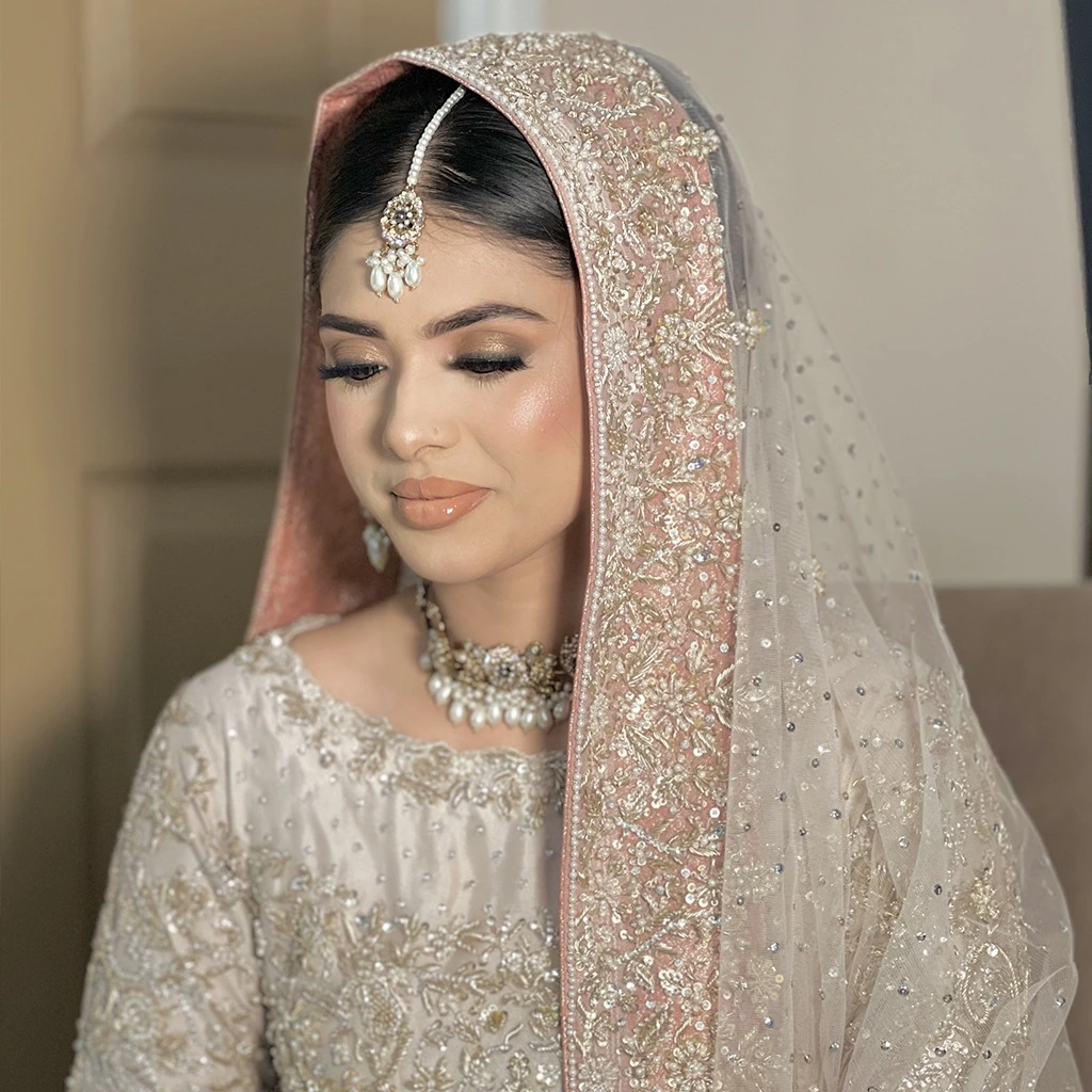 • A series of bridal looks featuring pastel maxis, layered lehengas, and organza dupattas. • Include both Western-inspired and traditional silhouettes. • Soft dewy makeup, minimal jewellery for a modern romantic vibe.